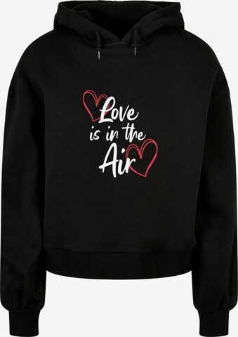 Merchcode Sweatshirt 'Valentines Day - Love is in the Air' in Zwart: voorkant
