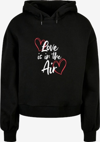 Merchcode Sweatshirt 'Valentines Day - Love is in the Air' in Zwart: voorkant