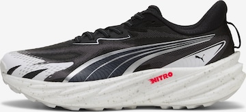 Baskets basses PUMA en noir : devant