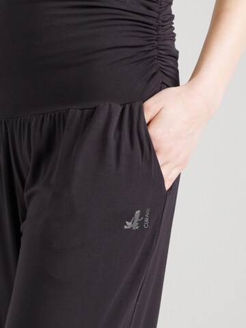 Tapered Pantaloni sportivi di CURARE Yogawear in nero