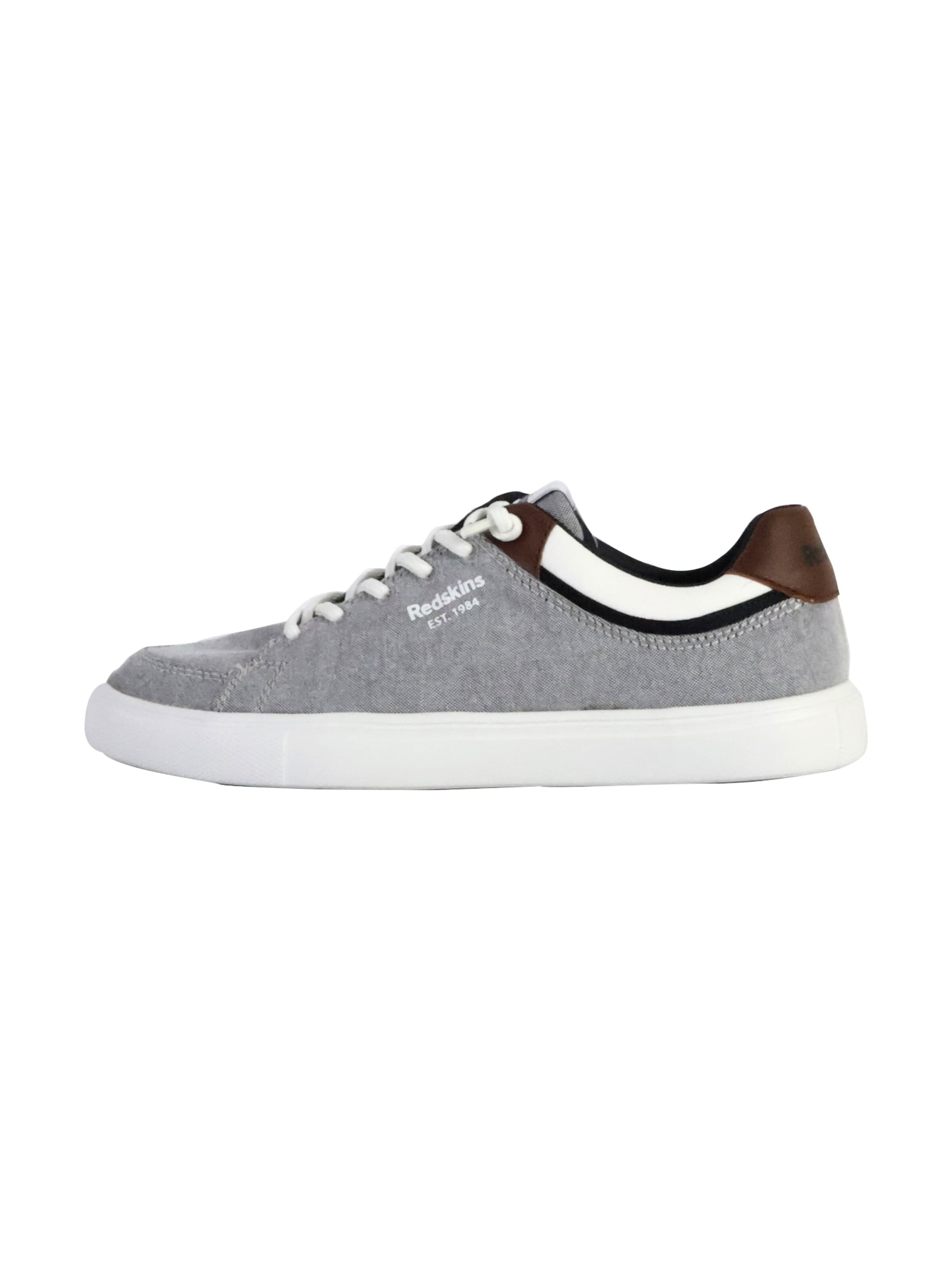 Chaussure de sport à lacets PUMA en gris : devant