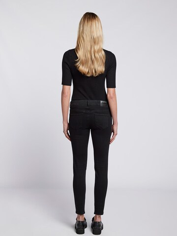 Skinny Jean Goldgarn en noir