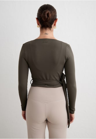 Aim'n - Blusa funcionais em verde