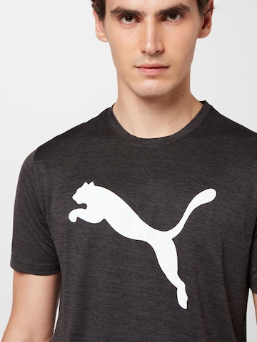 PUMA Sportshirt 'TRAIN FAV' in Schwarz