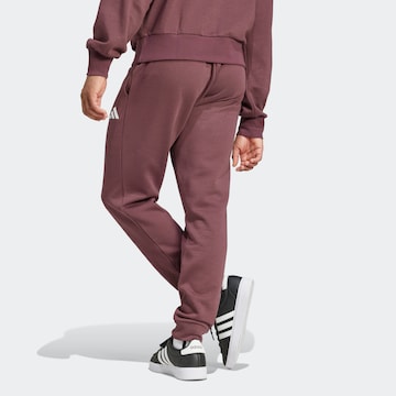 ADIDAS SPORTSWEAR Tapered Sporthose 'FEELCOZY' in Rot
