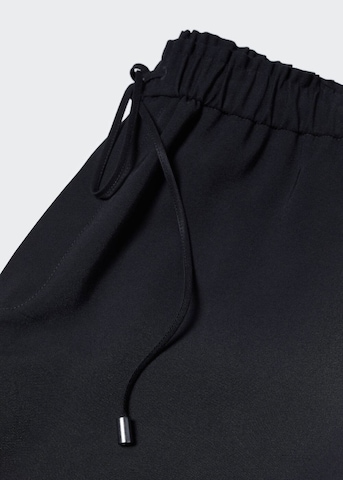 MANGO Lużny krój Spodnie 'Fluido' w kolorze czarny