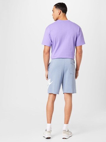 mėlyna Nike Sportswear Laisvas Kelnės 'CLUB ALUMNI'