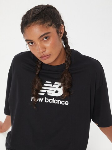 new balance قميص كبير الحجم 'Essentials' بلون أسود