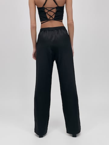 UNFOLLOWED x ABOUT YOU Loose fit Trousers 'Bossy' in Black: back