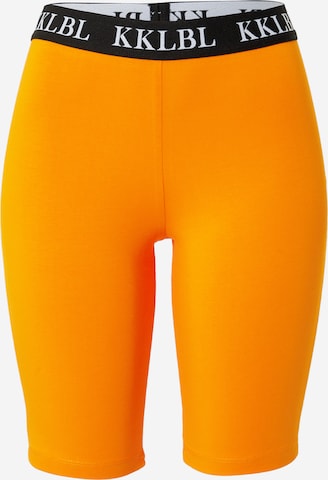 Karo Kauer Skinny Legíny – oranžová: přední strana