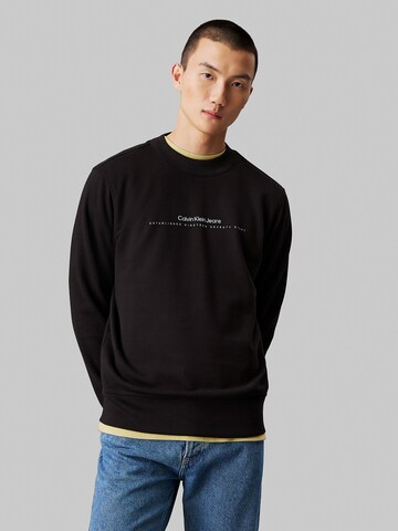 Sweat-shirt Calvin Klein Jeans en noir : devant