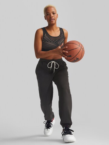 Effilé Pantalon de sport PUMA en noir