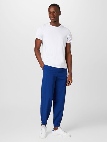 Tapered Pantaloni di Champion Authentic Athletic Apparel in blu