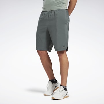 Reebok Regular Workout Pants in Green: front