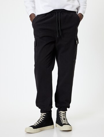 Koton Tapered Cargo Pants in Black: front
