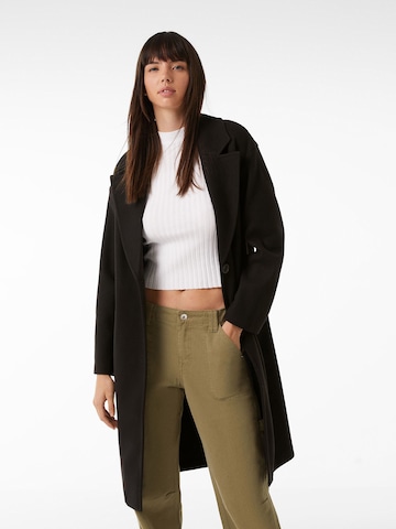 Bershka Between-seasons coat in Black: front