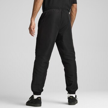 PUMA Tapered Sportbroek in Zwart