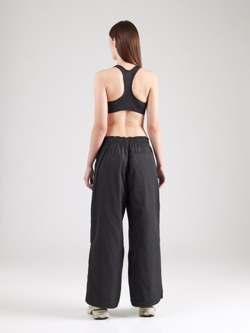 Nike Sportswear Wide leg Trousers 'Repel' in Black