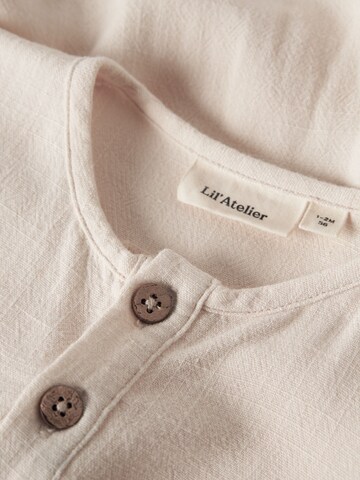 Tutina / body per bambino di Lil'Atelier in bianco