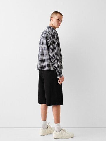 Bershka Loosefit Chino kalhoty – černá