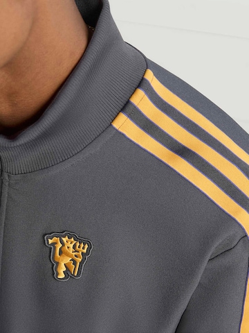 ADIDAS ORIGINALS - Sudadera con cremallera deportiva 'Manchester United Terrace Icons' en negro