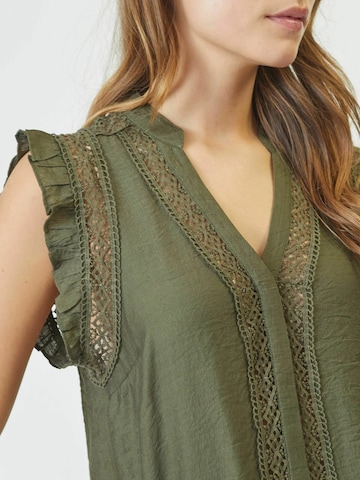 Haut ' Caryn' co'couture en vert