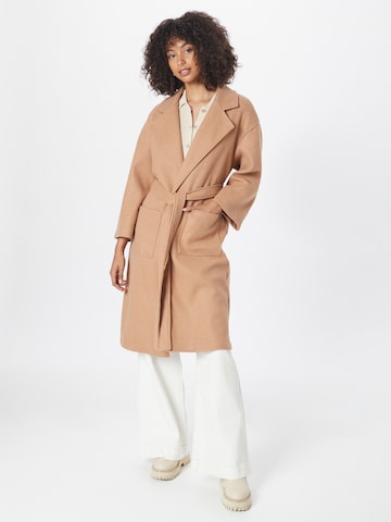 In The Style Between-Seasons Coat in Beige: front