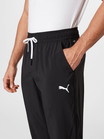 PUMATapered Sportske hlače 'Train Vent' - crna boja