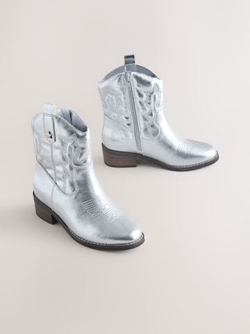 Next - Botas en plata
