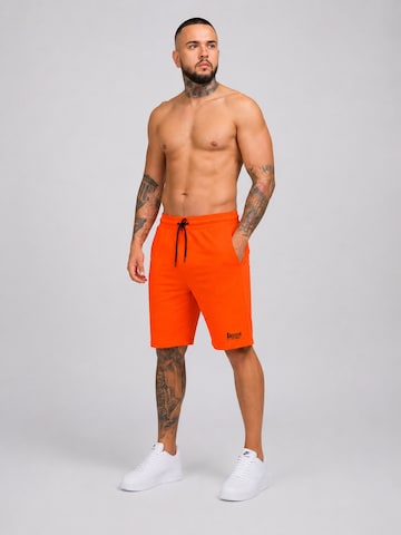 Regular Pantalon de sport 'Herren Baumwollshorts Boxeur des Rues, Orange, Schwarzes Logo' Boxeur des Rues en orange