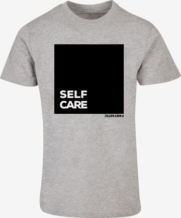 T-Shirt 'Self Care' F4NT4STIC en gris : devant
