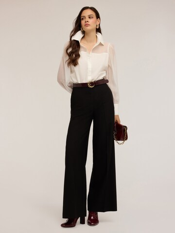 MOTIVI Wide leg Pants in Black: front