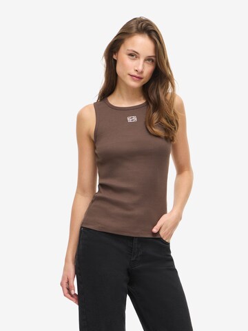 Noisy may Overdel 'NMMaya' i brun: forside