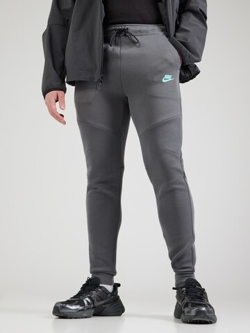 Nike Sportswear Tapered Trousers 'TCH FLC' in Grey: front