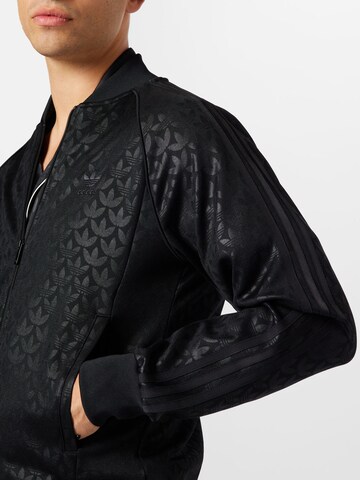 Veste de survêtement 'Graphics Monogram Sst' ADIDAS ORIGINALS en noir