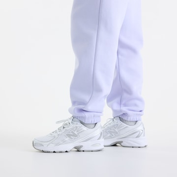 new balance - Tapered Calças 'Sport Essentials Fleece Jogger' em roxo