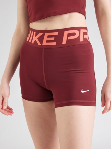 NIKE Skinny Spodnie sportowe w kolorze czerwony