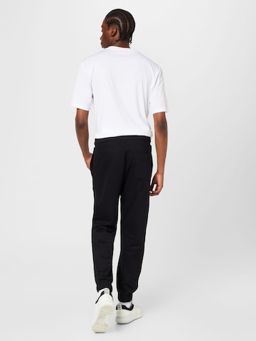 HUGO - Tapered Pantalón 'Dchard' en negro