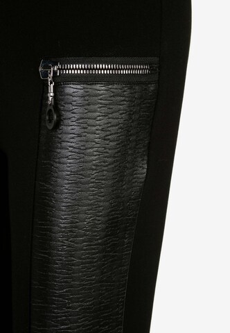 CIPO & BAXX Slimfit Leggings mit Reißverschluss aus Leder in Schwarz
