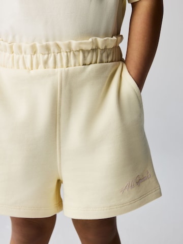 smALLSAINTS Set: T-Shirt und Shorts in Gelb