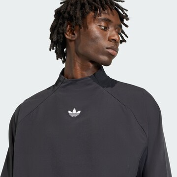 ADIDAS ORIGINALS Tussenjas 'Adicolor' in Zwart