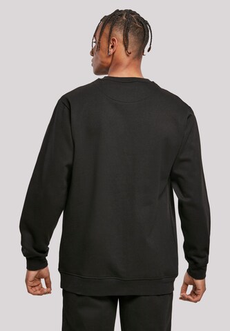 F4NT4STIC Sweatshirt 'Looney Tunes Group Faux Pocket' in Black