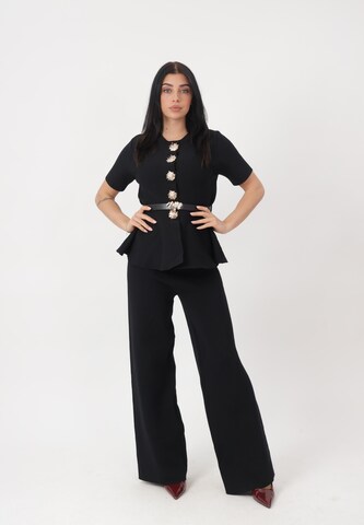 Elara Buksedragt i sort: forside