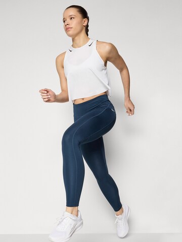 NIKE Skinny Spodnie sportowe 'Epic Fast' w kolorze niebieski