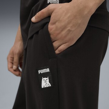 PUMA Wide leg Broek 'Puma x Ripndip' in Zwart