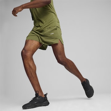 PUMA Regular Workout Pants in Green: front