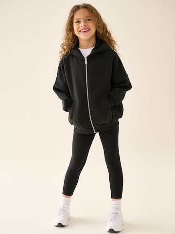 Next - Conjunto en negro: frente
