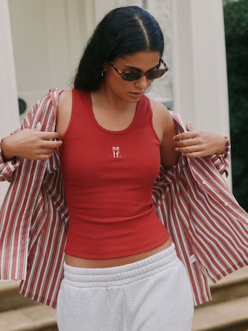 Top di self. in rosso