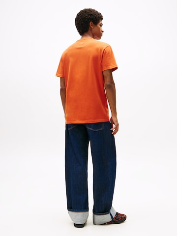 Tricou de la Tommy Jeans pe portocaliu