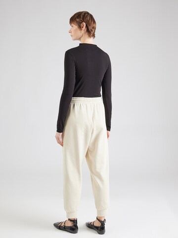 Tapered Pantaloni 'TRAIN VISIBILITY' di EA7 Emporio Armani in beige